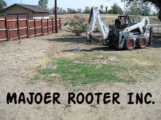 A field with equipment and a caption -Majoer Rooter Inc.