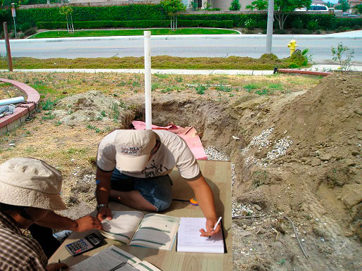 2 men are making a certification document for a septic tank for ESCROW